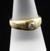 An 18ct gold and gypsy set solitaire diamond ring, size Q.