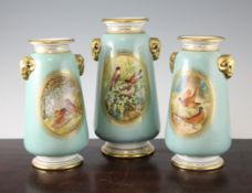 A garniture of three English porcelain vases, mid 19th century, each painted to an oval reserve with