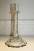 A George III facet cut glass candlestick, late 18th century, with diamond facet cut stem above a