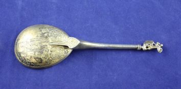 A 19th century continental 17th century design silver gilt anointing spoon, with cherub finial and