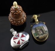 A 19th century carved coquilla nut gourd shaped scent bottle and two others, French gilt mounted and