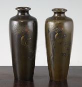 A pair of Japanese inlaid bronze vases, Meiji period, each of elongated ovoid form, decorated with a