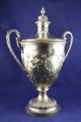 A large George V silver two handled presentation trophy cup and cover, with flambe urn finial and