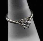 An 18ct gold and solitaire diamond ring, the round brilliant cut stone weighing approximately 0.