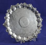 A George IV silver waiter, of shaped circular form, with engraved thistle and floral scroll