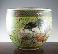 A large Chinese famille rose fish bowl, late 19th century, painted to shaped reserves with a four