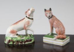 Two Staffordshire pearlware figures of a fox and a hound, c.1800-20, the fox seated upon a