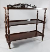 An early Victorian mahogany three tier buffet, with scroll carved back, W.4ft H.4ft 2in.