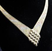 A 9ct three colour gold plaited tapering necklace and a pair of similar earrings, gross 25.9 grams.
