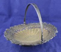 An Edwardian silver oval cake basket, with pierced cross and repousse foliate scroll border and