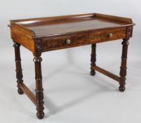 A William IV mahogany side table, with three quarter gallery, two frieze drawers, lion mask circular