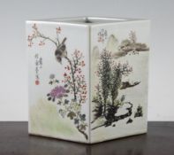 A Chinese famille rose lozenge shaped vase, painted with bird amid flowers, a figure in a river