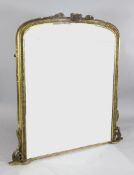 A Victorian gilt overmantel mirror, the frame decorated with lunettes and acanthus scroll corner