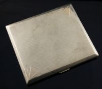 A 9ct gold engine turned cigarette case, gross 121.9 grams.