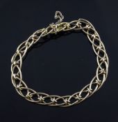 A 15ct gold bracelet, with double links and safety chain, 14.5 grams.
