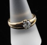 A gentleman`s 18ct gold claw set solitaire diamond ring, with oval cut stone, size R.