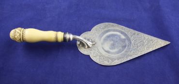 A Victorian ivory handled silver trowel , with carved foliate handle and blade with engraved foliate