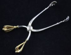 A cased pair of Danish parcel gilt sterling silver sugar tongs by W & S. Sorensen, the handles