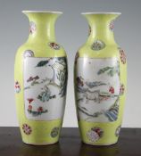 A pair of Chinese famille rose yellow ground vases and a similar pair of dishes, early 20th century,