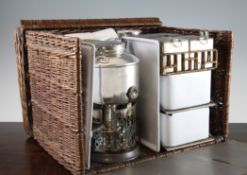 A Drew & Sons `En Route` wicker picnic hamper, complete with cups, trays, kettle and burner,