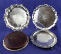 Three 20th century silver waiters with engraved inscriptions and a silver mounted coaster, 28 oz.