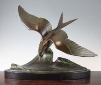 A French Art Deco patinated bronze of a seagull on a crest of a wave, signed to the back Davergne,