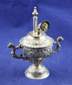A Victorian silver two handled club cigar lamp by William Comyns, of vase form, embossed with