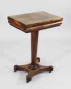 A 19th century rosewood occasional games table, the folding swivel top opening to reveal a