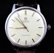A gentleman`s 1960`s stainless steel Omega Seamaster automatic wrist watch, with baton numerals,