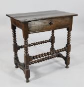 A 17th century oak side table, with single drawer, on bobbin turned underframe, W.2ft 4.5in.