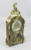 An early 18th century French boulle work mantel clock, with putto finial, enamelled tablet