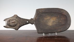 A Grebo West African ceremonial ladle or spoon, the handle relief carved with an oval mask and