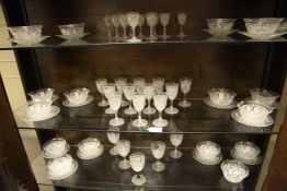An Edwardian strawberry cut suite of table glass, to include eighteen finger bowls and seventeen ice