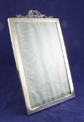An Edwardian silver ribbon top photograph frame, of plain rectangular form, Wright & Davies, London,