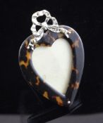 A late Victorian silver and tortoiseshell mounted miniature heart shaped photograph frame, with