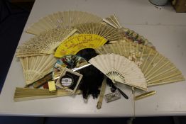 A 19th century French bone fan, with colour printed leaves, other similar fans and a Victorian