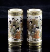 A pair of Japanese Satsuma pottery small cylindrical vases, Meiji period, each painted with children