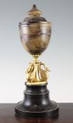 A 19th century Blue John urn shape lamp, the gilt bronze base modelled as three swans, on a