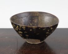 A Chinese Jian ware `paper cut` teabowl, Song/Jin dynasty, the interior decorated with four square