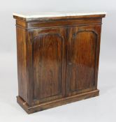 A 19th century rosewood side cabinet, with rectangular marble top over two panelled doors, on plinth