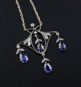 A late 19th/early 20th century Belle Epoque gold and silver, sapphire and diamond drop pendant, of