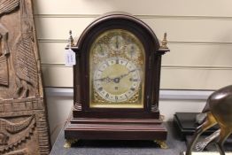 An Edwardian mahogany repeating chiming bracket clock, with arched brass dial, eight bell / four