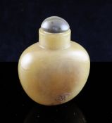 A Chinese creamy brown agate snuff bottle, 19th century, one side incised with a bat near the