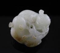 A Chinese white and russet jade carving of two cats, 18th/19th century, each biting a sprig of