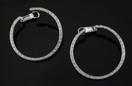 A large pair of white gold and diamond set hoop earrings, 1.75in.