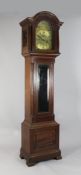 An early 20th century mahogany chiming eight day longcase clock, the 13 inch arched brass dial