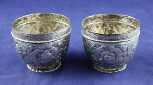 A pair of late 19th century Hanau 800 standard silver tumbler cups, of circular form, embossed