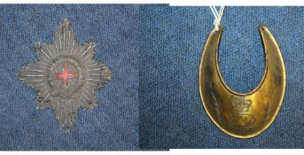 A George III gilt copper officer`s gorget, a woven wire and silk Order of the Garter badge inscribed