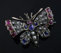 An early 20th century gold and silver, ruby, sapphire, split pearl and diamond set butterfly brooch,