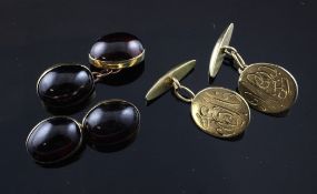 A pair of 9ct gold and cabochon garnet cufflinks and a pair of 18ct gold cufflinks with engraved